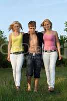 Two pretty blonde and young man walking