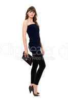 Beautiful girl in black leggings with a handbag