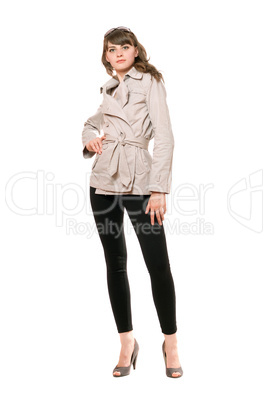 Nice girl wearing a coat and black leggings. Isolated