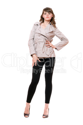 Pretty young woman wearing a coat and black leggings