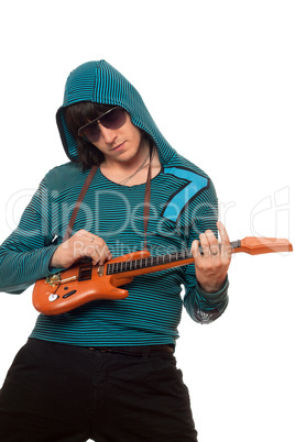 Young man in sunglasses with a little guitar