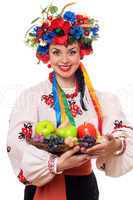 woman in the Ukrainian national clothes with fruit