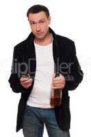 Man with a phone and bottle of scotch