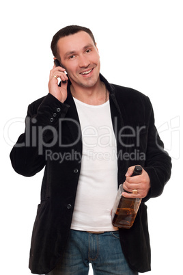 Smiling man with a phone and bottle of scotch