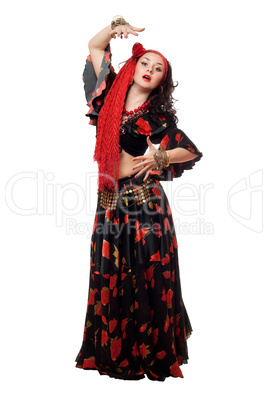 Expressive gypsy woman in a black skirt. Isolated
