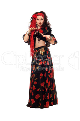 Sensual gypsy woman in a black skirt. Isolated
