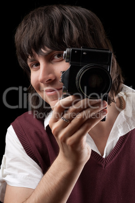 Smiling photographer with the vintage camera