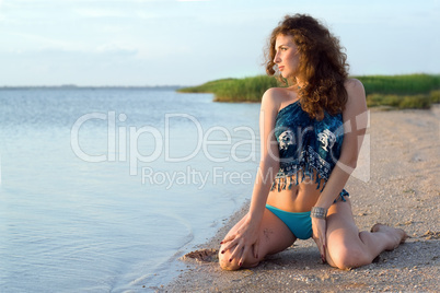 Young woman sitting on the bay