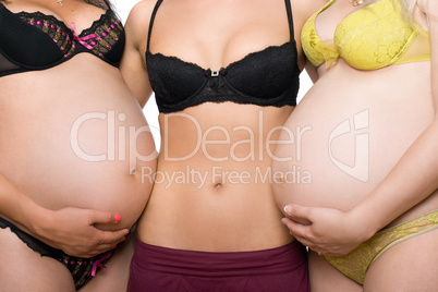 Three female tummy. Isolated