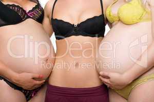 Three female tummy. Isolated