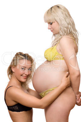 young woman and a pregnant girlfriend