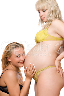 Pregnant woman with the pretty girlfriend. Isolated