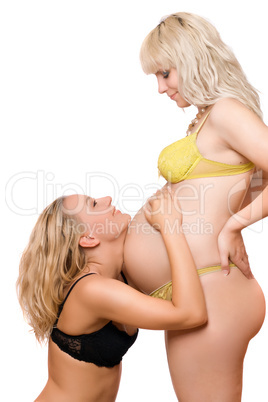 Pregnant woman with the joyful girlfriend. Isolated