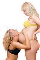 Pregnant woman with the joyful girlfriend. Isolated