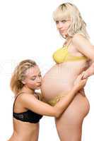 Pregnant blond woman with the girlfriend