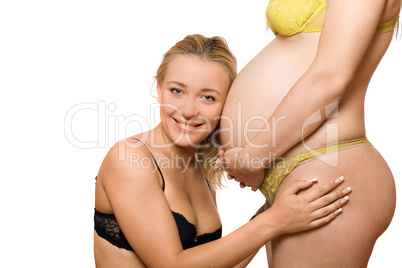 Happy woman and belly of pregnant girlfriend