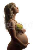 Pregnant young woman in yellow lingerie. Isolated