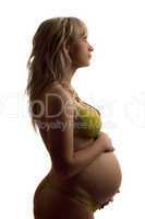 Pregnant young woman in yellow lingerie
