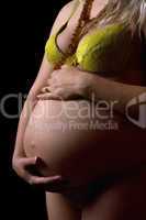 Belly of a young pregnant woman. Isolated