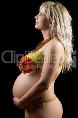 Pregnant young blonde with red flower. Isolated