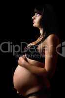 Pregnant young woman in lingerie. Isolated