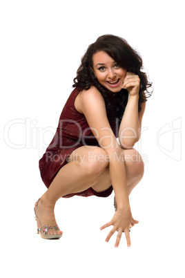 Smiling young brunette in red dress