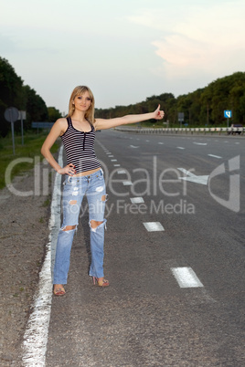 Young woman on the roadside