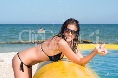 young woman by the yellow pool