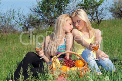 Two pretty blonde with wineglasses