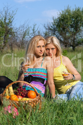 Two sensual blonde with wineglasses