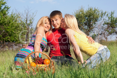 Two playful blonde and young man