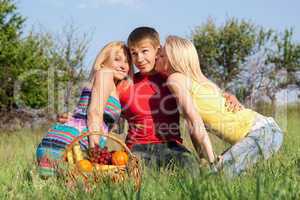 Two playful blonde and young man