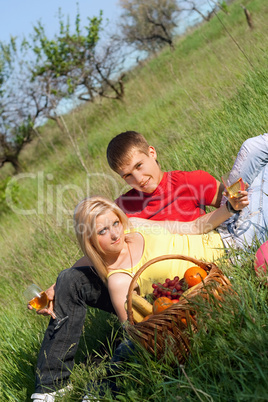 Beautiful blonde and young man with wineglasses