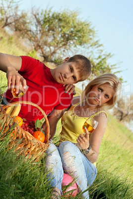 Attractive blonde and young man with wineglasses