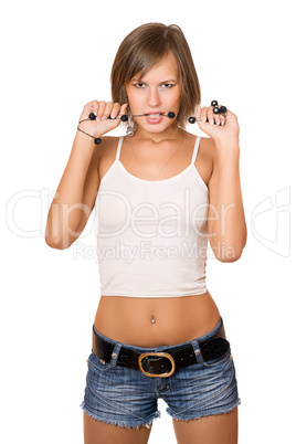 Portrait of passionate girl in a white top and denim shorts