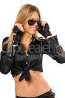 smiling young blonde talking on two phones