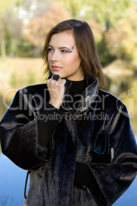 nice young woman in autumn park