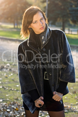 lovely young woman in autumn park