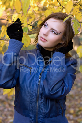 beautiful girl amongst the autumn leaves