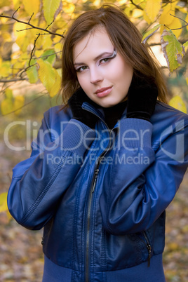 attractive girl amongst the autumn leaves