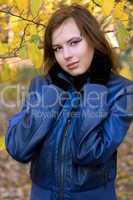 attractive girl amongst the autumn leaves