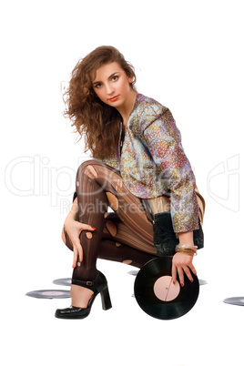 Beautiful young woman with vinyl disc