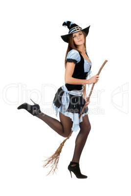 Playful young woman with a besom