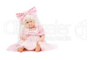 Baby girl in a pink dress. Isolated