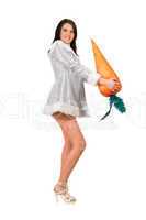 Beautiful young brunette with a carrot