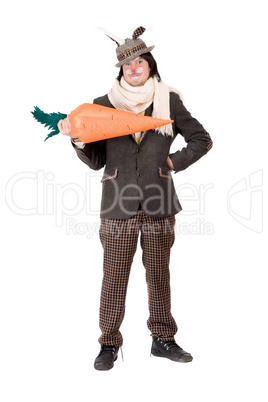 Smiling young man with carrot