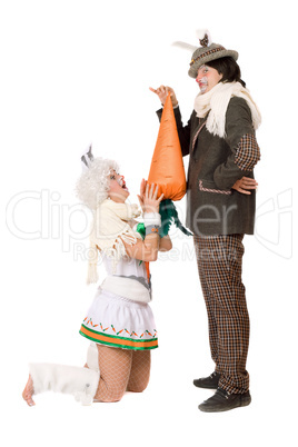 Funny young couple with carrot