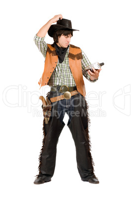Pensive young cowboy with a bottle