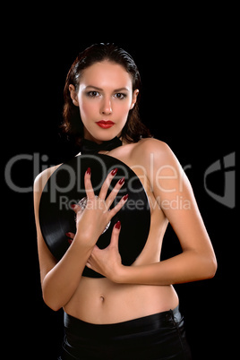 Sexy young brunette topless with vinyl