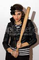 Pretty young woman with a bat